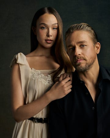two individuals posing together one with long hair and a light dress the other in a black shirt two individuals posing together one with long hair and a light dress the other in a black shirt