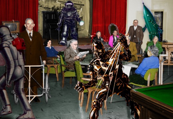 A hand-tinted image of elderly people in the lounge of a nursing home. Three killer robots have been inserted into the scene.