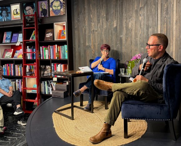 A photo of me with Angie Coiro onstage at Kepler's Books.