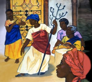 The tungutu Pa Sini Jobu dances with her staff as the Kie play music