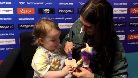 Bethany Firth with daughter Charlotte after winning a bronze medal