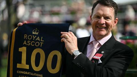 Trainer Aidan O'Brien poses after training his 100th winning horse