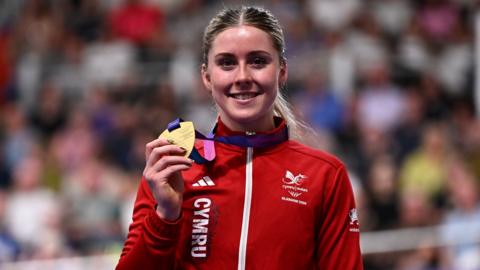 Emma Finuacane holds a Commonwealth Games medal