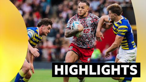 Liam Horne of Leigh is tackled by Liam Byrne and Ewan Irwin of Warrington