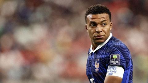 Kylian Mbappe looks on