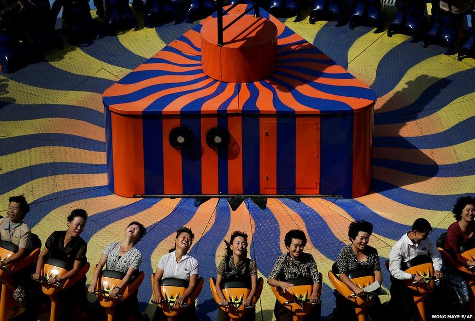 North Koreans enjoy a ride at the Kaeson Youth Amusement Park