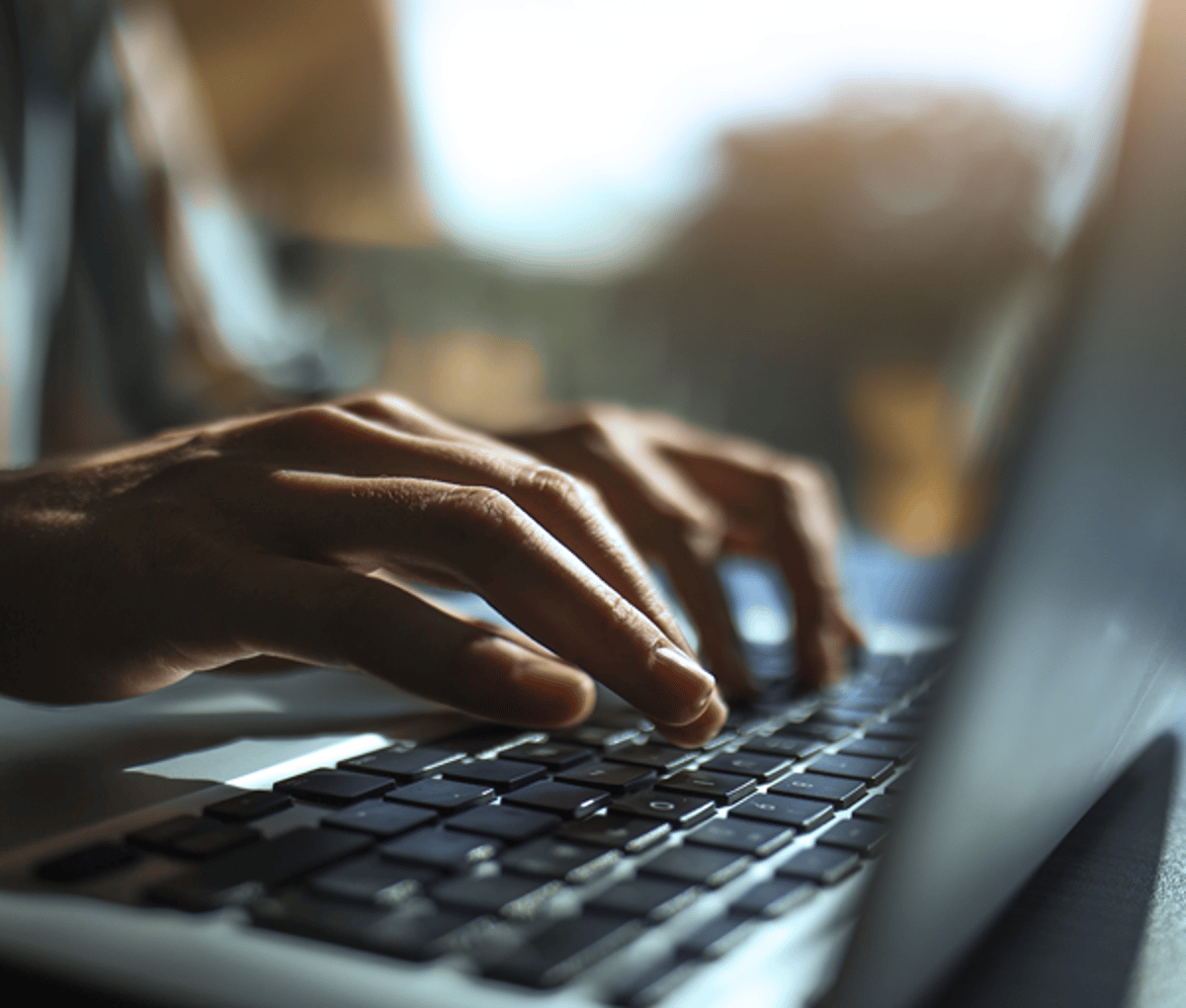 Hands typing on keyboard