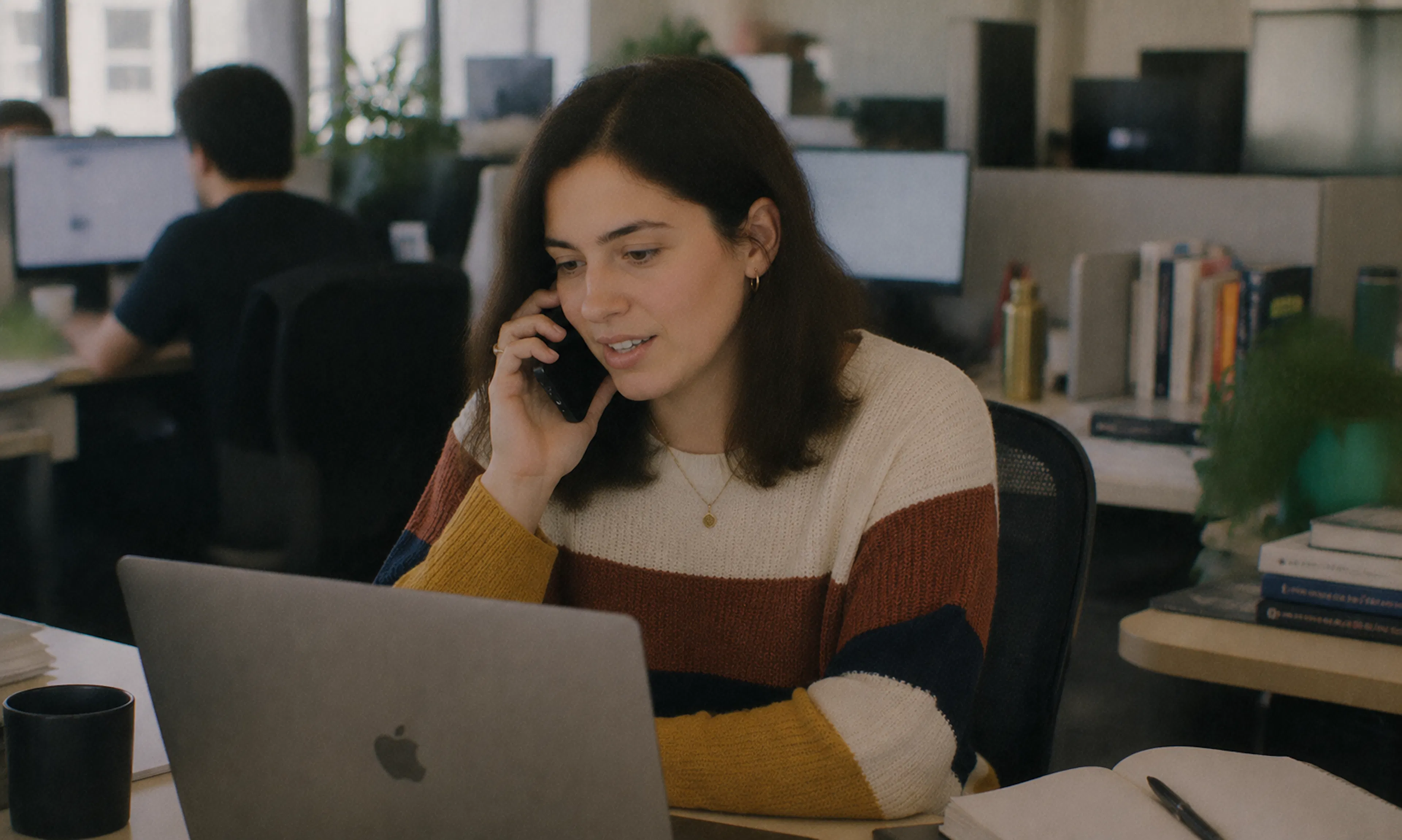 woman working in busy office