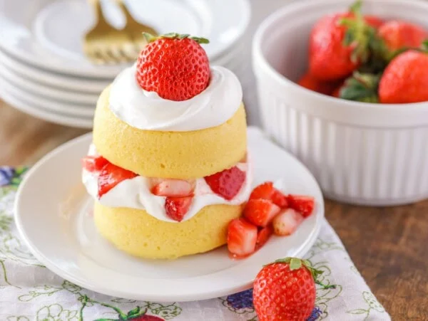 Easy strawberry shortcake topped with whipped cream and fresh strawberries.