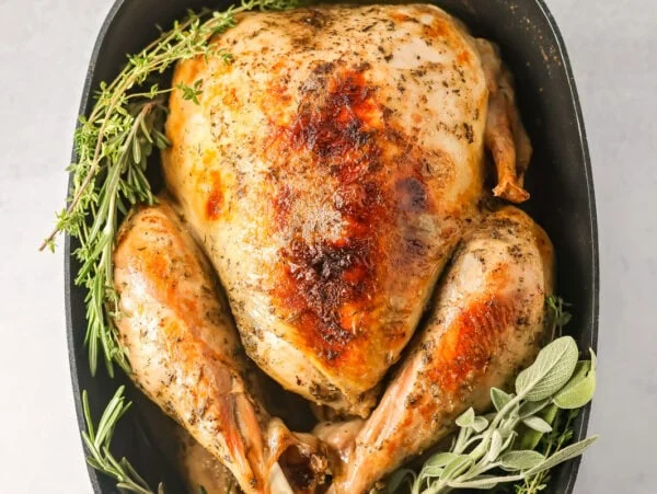 A crock pot turkey served with seasonings.