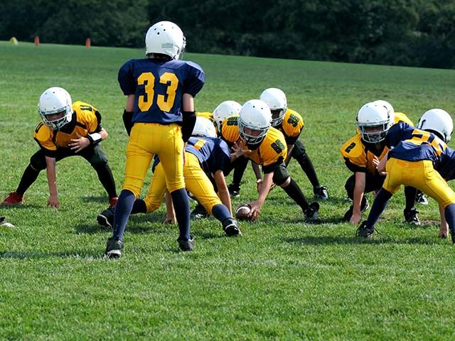 WATCH: Football Dad, 41, Trips Player, 9, Preventing Him from a Touchdown