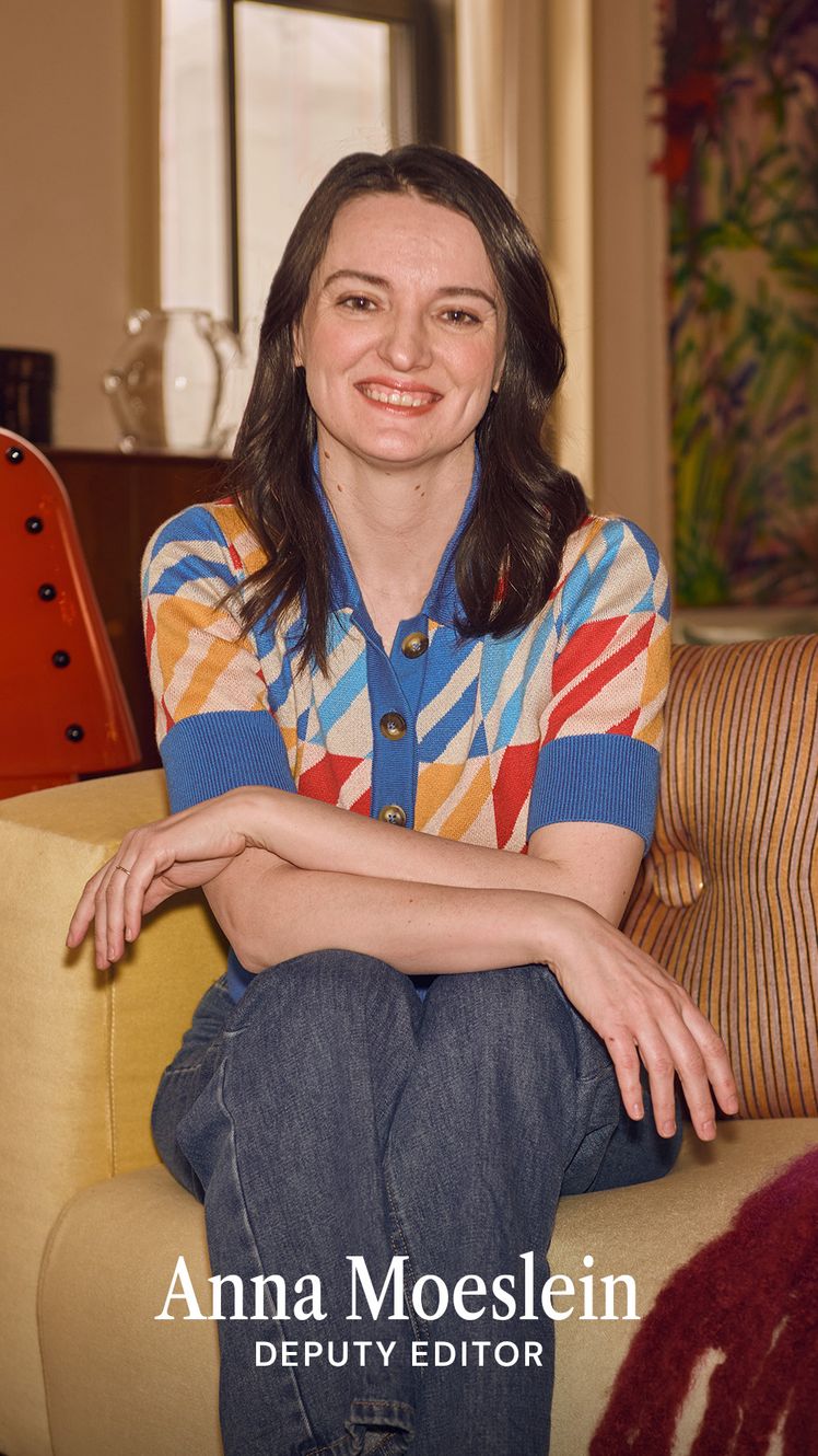 Image may contain Couch Furniture Blouse Clothing Face Head Person Photography Portrait Adult Pants and Happy