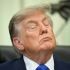 US President Donald Trump closes his eyes before signing an executive order calling for more research and flexibility on vaccines, in the Oval Office of the White House in Washington, DC, on August 10, 2026.