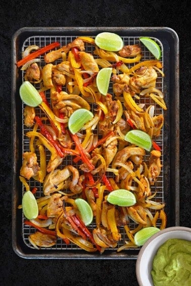Sheet Pan Chicken Fajitas + Avocado Crema by Michelle Tam / Nom Nom Paleo https://nomnompaleo.com