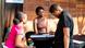 Three people in discussion, standing at a bar table Three people in discussion, standing at a bar table