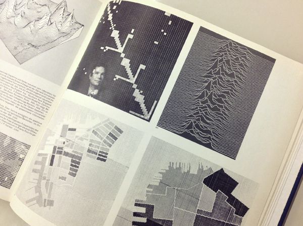 Photograph of a book with the pulsar graphic