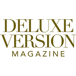 The image displays the "Deluxe Version Magazine" logo in gold, serif capital letters on a white background. The image displays the "Deluxe Version Magazine" logo in gold, serif capital letters on a white background.