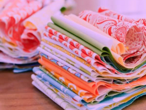 Stack of colourful fabric pieces.