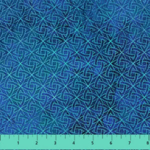 Blue Celtic knot fabric pattern with ruler.