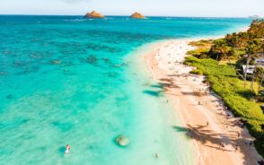 Aerial photo of the blue water and white sand beaches of Lanikai Beach