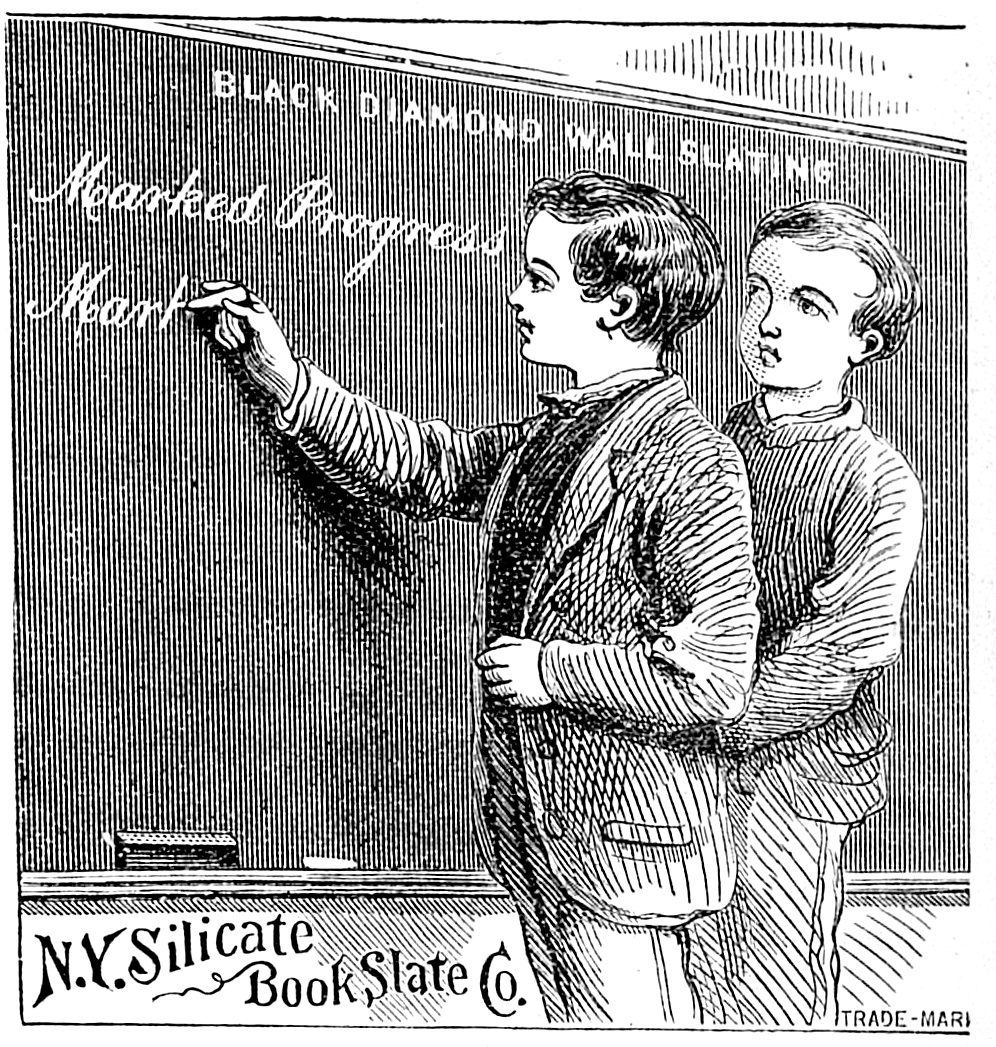 Student writing “Marked Progress” on Black Diamond Wall Slating