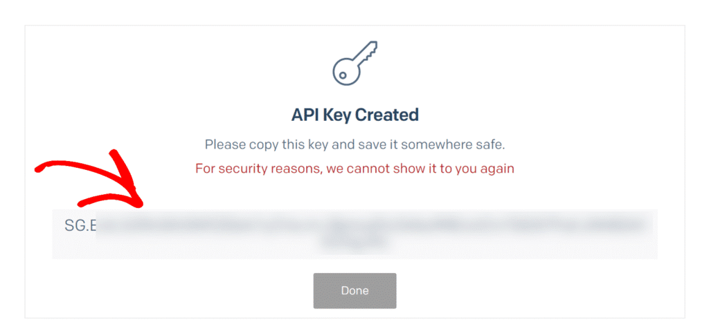 API key created; copy and store it securely. The full key is blurred for security and cannot be shown again.