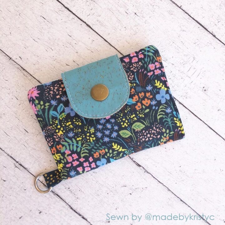 a finished fabric mini wallet in floral fabric and a cork flap