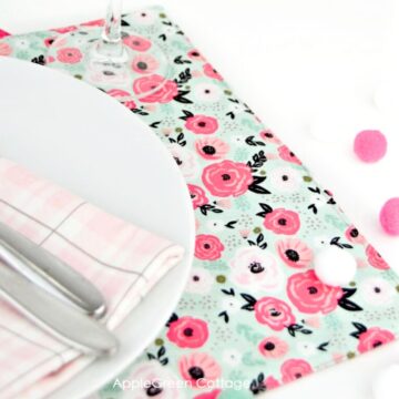 a finished handmade placemat sewn from beauiful fabric using a free sewing pattern