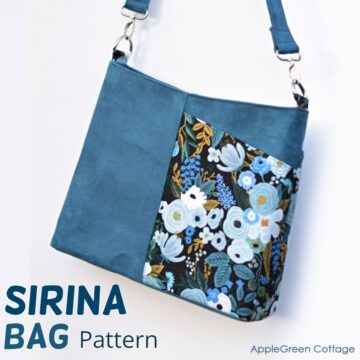 finished handmade purse with a shoulder strap in blue faux leather and floral fabric