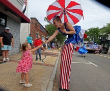 250th parade A small child gets an extra high five from a participant as Hull celebrated the 250th anniversary of the US with a parade. Stuart Cahill/Boston Herald