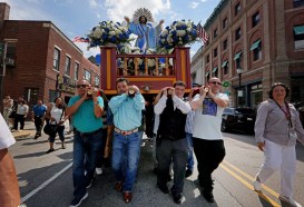 Patron Feast of El Salvador East Boston, MA - Men carry the statue of Christ during the Cristo, Divino Salvador del Mundo, the patron feast of El Salvador . (Nancy Lane/Boston Herald)
