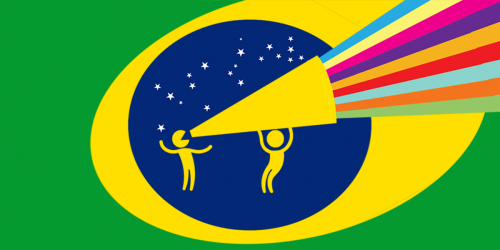 One person holds a megaphone for another, with Brazil flag