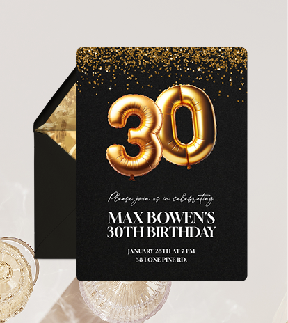 Black birthday invitation with gold confetti and gold foil balloon numbers 30 for Max Bowen’s 30th birthday.