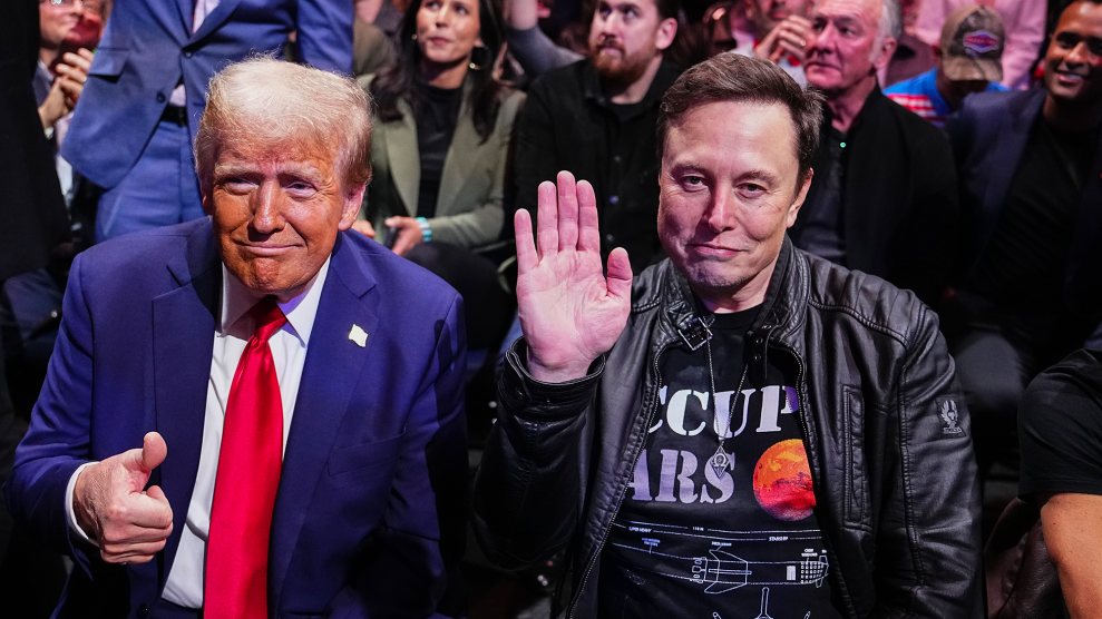 Elon Musk, wearing an "Occupy Mars" t-shirt, sits next to President Trump at a UFC event.