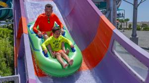 OCR-L-WILDRIVERS-0719-JA-21 Albert Nevarez and his son, Aiden Nevarez, 8, of Hawthorne scream as they ride down a steep section of Pelican Plunge at Wild Rivers Waterpark in Irvine on Saturday, July 18, 2026. (Photo by Jeff Antenore, Orange County Register/SCNG)