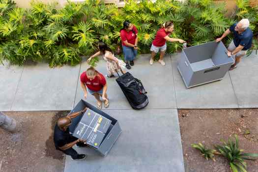 OCR-L-CHAPMANMOVEIN-0819_015 Resident Advisors Grace Cummins, Erika Ramos and Ainsley Manus help parents locate dorm buildings on Tuesday, Aug. 18, 2026 at Chapman University in Orange. (Photo by Claire Nguyen, Contributing Photographer)