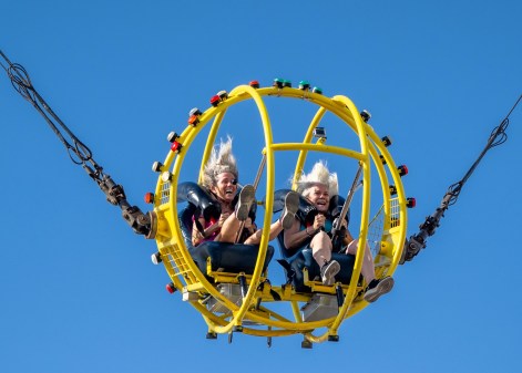 OCR-L-FAIRLASTWK-0811-JA-01 Denise Dickinson, left, of Costa Mesa and Tracie Guier of Tustin hold on tight as they ride the Sling Shot, which launches riders at 60 mph, with 4.5 G’s of force, 200 feet into the air, at the OC Fair in Costa Mesa on Wednesday, August 5, 2026. (Photo by Jeff Antenore, Orange County Register/SCNG)