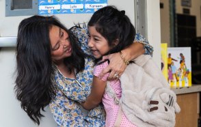 OCR-L-GG-BTSKL-0811-01-PB Valentina Olivar is hugged by her second-grade teacher Irene Takushi on the first day of school at Bryant Elementary School in Garden Grove on Monday, August 10, 2026. (Photo by Paul Bersebach, Orange County Register/SCNG)