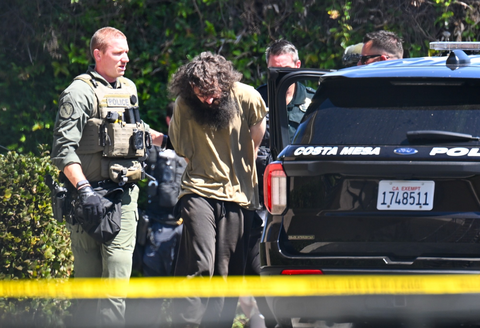 OCR-L-STANDOFF-0819-JG_4 Police detain a suspect at the Costa Mesa Village apartments from a non-fatal shooting earlier in the morning at a near-by Stater Bros in Costa Mesa on Tuesday, August 18, 2026. (Photo by Jeff Gritchen, Orange County Register/SCNG)