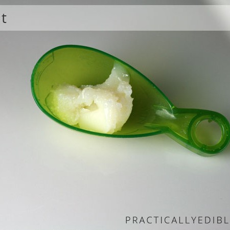 Duck fat in a scoop