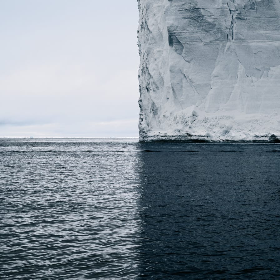 A Towering Iceberg and Its Shadow Split the World into Quadrants