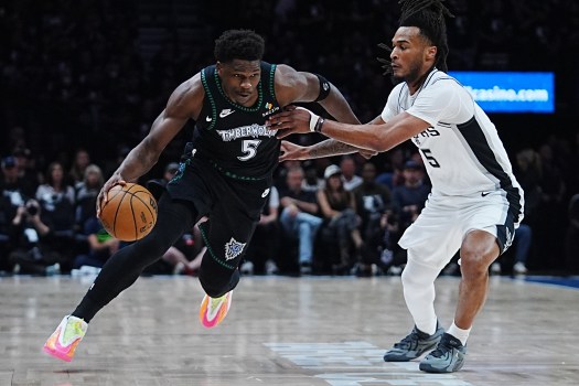 Spurs Timberwolves Basketball Anthony Edwards dribbles