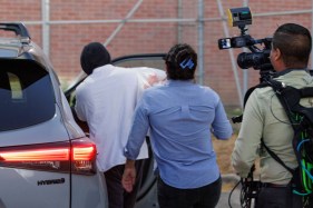 US Immigration Enforcement Minnesota A person getting into a car