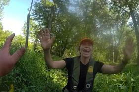 Michigan_River_Rescue_4_975 This image made from video provided by the Michigan Department of Natural Resources shows conservation officer Anna Cullen celebrating on Friday, Aug. 7, 2026, in Twin Lake, Mich., as a search and rescue team found two women and a child who had been missing after taking a river tubing trip. (