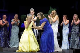 STP-L-CORONATION2 A woman begins to cry as a crown is placed on her head
