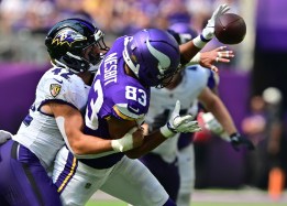 STP-L-jea 29 VIKINGS_BALTIMORE - 0822 Bryson Nesbit (83) is held by a Baltimore Ravens linebacker