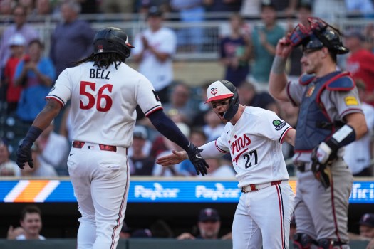 Braves Twins Baseball Twins catcher Ryan Jeffers greets Josh Bell at home plate after Bell's home run