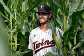 Phillies Twins Baseball A player smiles against corn stalks